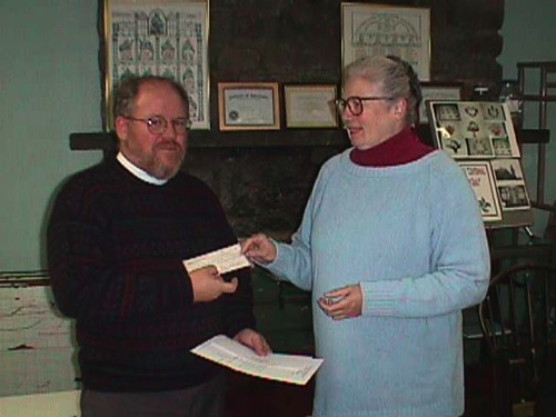 Leslie, on behalf of the Society, presenting a donation to Rev. Dan Strong of St. Paul's Church. 1999-10-20 MVC-010CHS.JPG